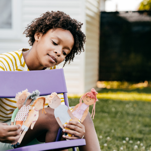 Engineering Your Future Today - Young Girl Playing With Paper Dolls