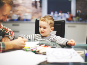 Engineering Your Future Today - Father And Son Completing Activity Together